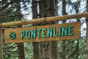 Sign with the inscription Pontenline in the forest