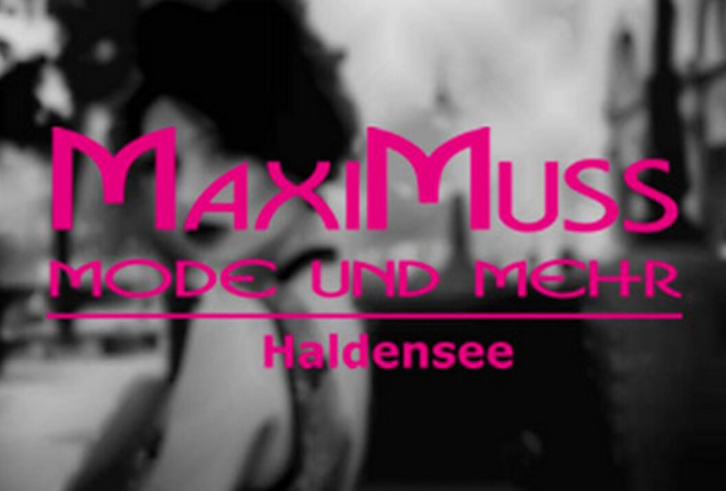 Blurred black and white photo with pink text
