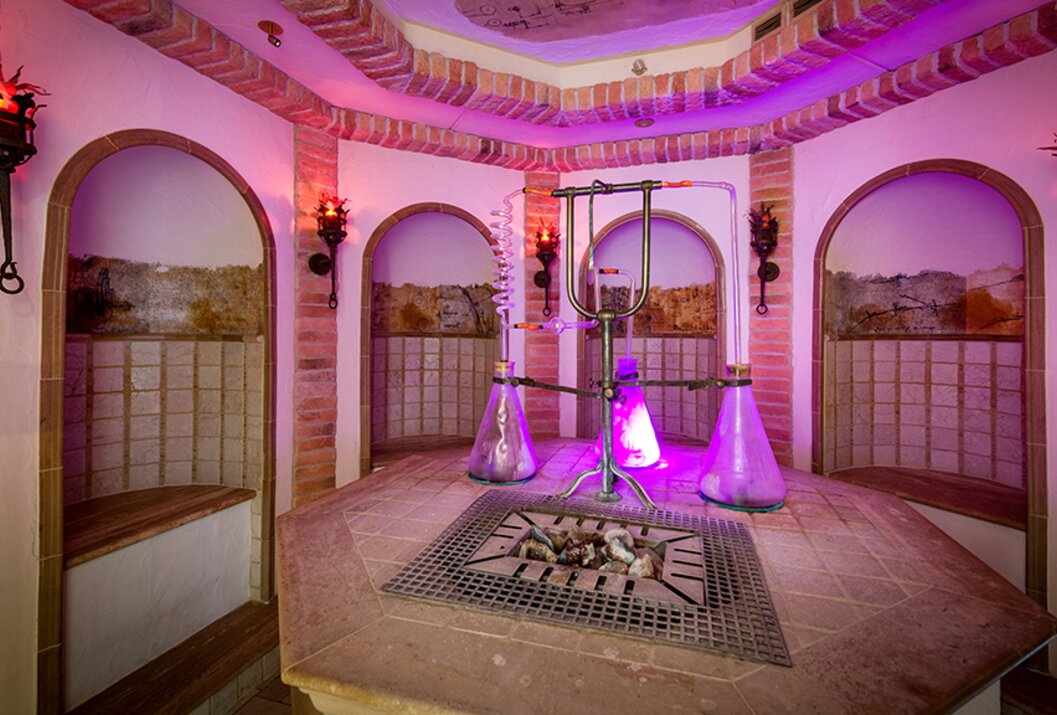 Interior with brick walls, niches, glass apparatus and violet light
