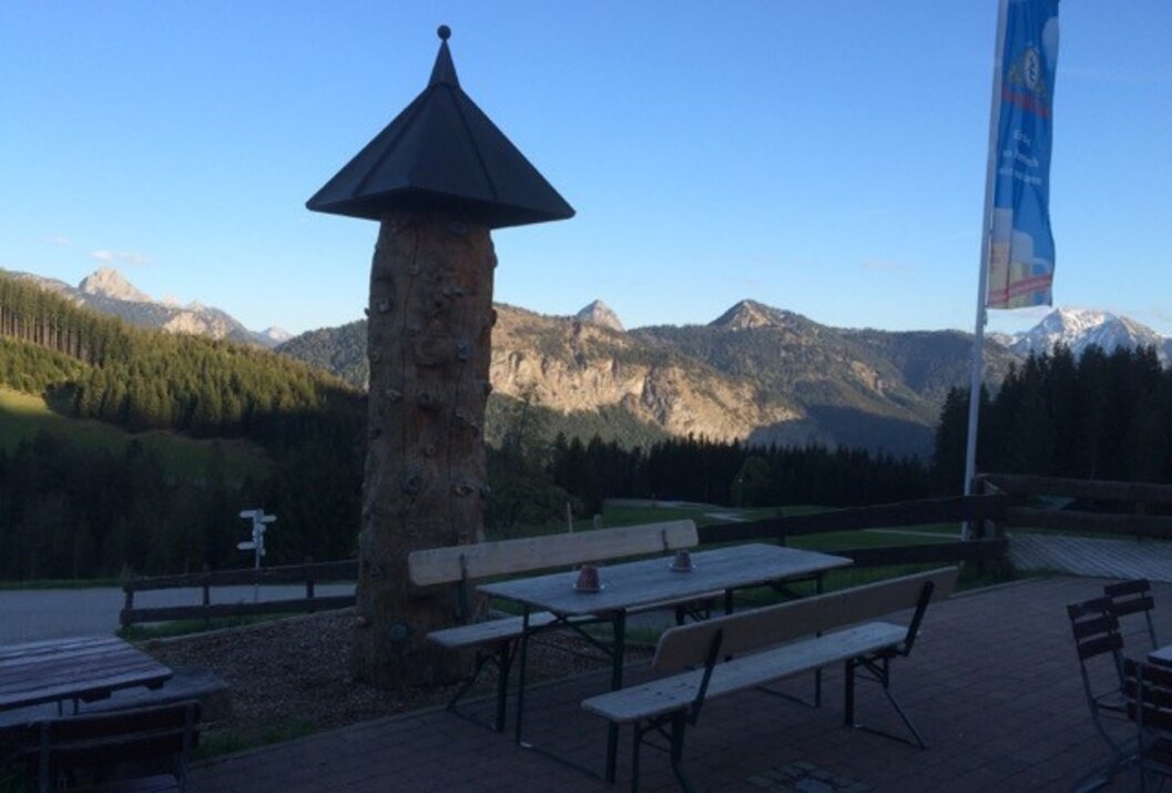 Wooden structure on mountain restaurant terrace with Alpine view